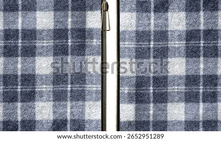 Fleece fabric texture with checkered pattern and zipper opened. Unzipped zipper or fastener. Open zip and Fleece material with plaid pattern of grey, light gray color. Isolated on white background
