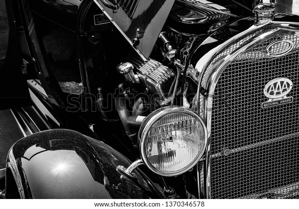 Fleet, Hampshire, UK – June 05 2016: The\
front of an old Ford on display at a car\
show