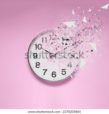 Fleeting time concept. Analog clock dissolving on pink background