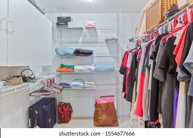 Fleming Island, Florida / USA - November 9 2019: Womens Walk-in Closet With Clothes And Shoes