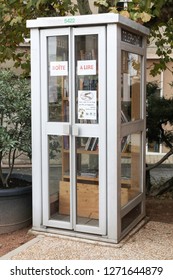 Fleurie, France - November 8, 2018: Telephone Box In France Recycled In Box Book