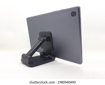Flexible Black Table Holder for Tablet and Mobile Phone in White Isolated Background