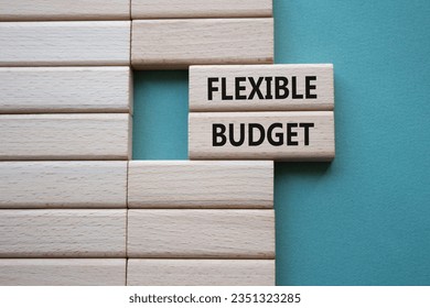 Flexible budget symbol. Concept words Flexible budget on wooden blocks. Beautiful grey green background. Business and Flexible budget concept. Copy space. - Shutterstock ID 2351323285