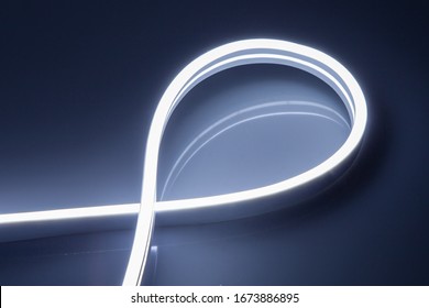 Flexible Cold White LED Neon Strip On Black Background.