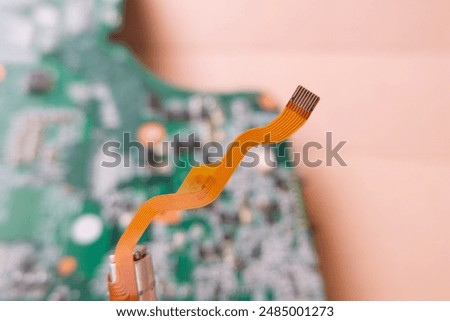 Flexible data cable used in high-tech electronic devices. Focused on the flat cable.