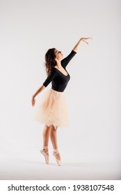 Flexible female, ballet dancer in black bodysuits, ballerina