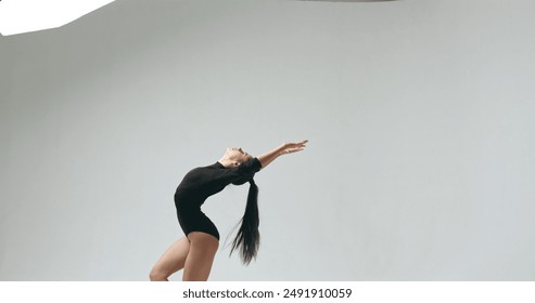 Flexible girl in a jump. - Powered by Shutterstock