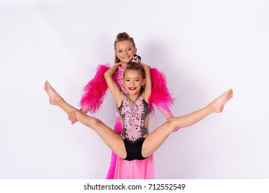 Flexible kids gymnasts, isolated on white background. Sport, active lifestyle concept