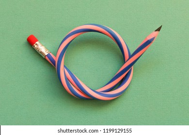 Flexible pencil . Isolated on light background. Bending pencil. - Shutterstock ID 1199129155