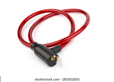 Flexible red bicycle cable with key on white background. Protecting your bike from hacking. Security and safety concept.