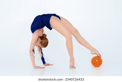 Flexible rhythmic gymnast with ball doing backbend, isolated on white background. Panorama - Powered by Shutterstock