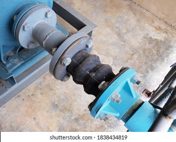 Flexible Rubber Expansion Joints With Nuts And Bolts. Flex Hose In Plumbing System. For Reducing Vibration Between Pump And Water Supply Pipe. Selective Focus