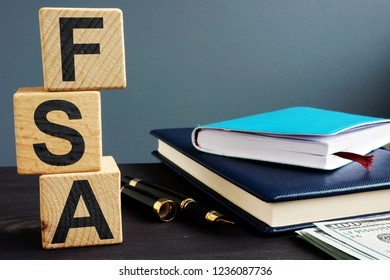 Flexible Spending Account FSA Written On A Wooden Cubes.