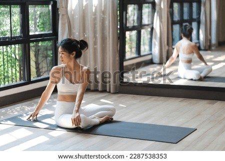 Flexible sport asian woman warming up Fitness woman doing stretch exercise stretching exercising Fitness healthy relaxation Home workout concept