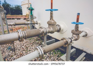 Flexible stainless steel pipe flange valve tank installed with Flexible hoses for reducing the force between the oil storage tanks In and out pressure. - Powered by Shutterstock