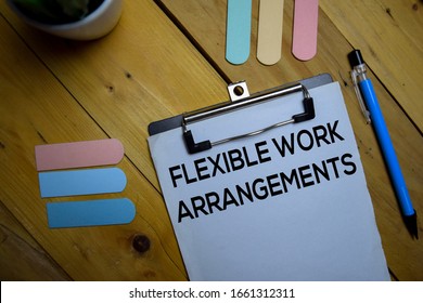 Flexible Work Arrangements Write On A Paperwork Isolated On Wooden Background.