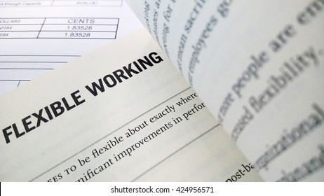 Flexible Working Word On The Book With Balance Sheet As Background
