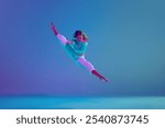 Flexible young girl, passionate hip hop dancer in motion on stage, performing dynamic moves against gradient blue background in neon light. Concept of freestyle dance, modernity, urban culture, youth