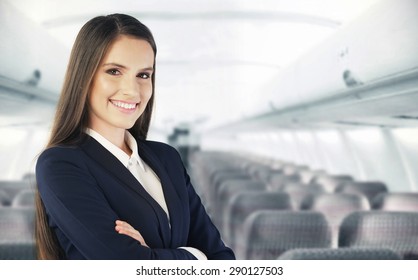 Flight attendant waiting for the passengers to board