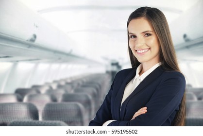Flight attendant waiting for the passengers to board