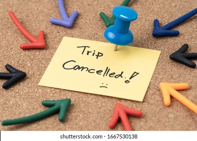 Flight Cancelled Due To COVID-19 Virus Spread Outbreak, Cancel Plan To Travel Reminder Concept, Thumbtack Pushpin With Multi Arrows Pointing To Small Paper Note Written The Word Trip Cancelled.