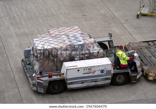 Flight cargo container tractor\
at Zurich airport. Photo taken May 1st, 2021, Kloten,\
Switzerland.
