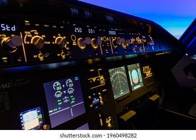 The Flight Control Unit Of An Commercial Aircraft, With Various Knows And Switches To Control The Aircraft Systems. 