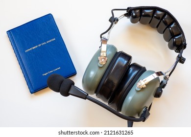 Flight Crew Pilot License And Headset As A Concept For Flight School Or Airline.