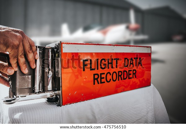 Flight data\
recorder from a plane. Black\
box.