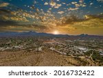 Flight with a drone over a with low houses in small Fountain Hills town near mountain desert in Arizona US