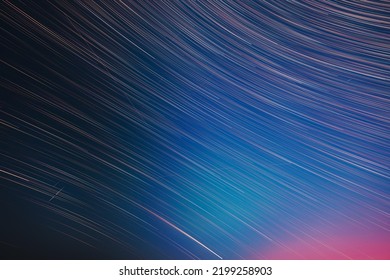 Flight Of Fancy. Abstract Amazing Star Trails On Night Sky Background. Bright Night Starry Sky. Soft Colours. Large Exposure. Imagination, Fantasy, Illusion, Dream View. Saturated Bright Blue, Red