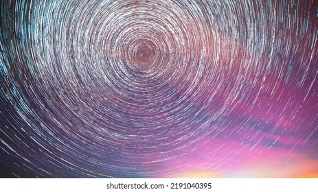 Flight Of Fancy. Amazing Star Trails On Night Sky Background. Bright Night Starry Sky. Soft Blue-orange-pink Colours. Large Exposure. Imagination, Fantasy, Illusion, Dream View.