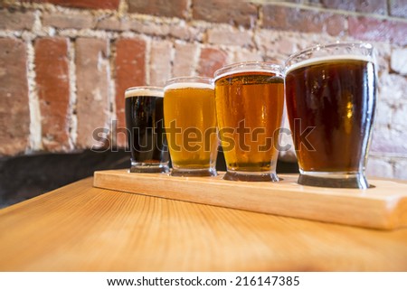 Flight of Four Beers for Tasting in a Pub