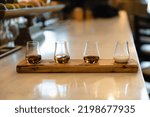 a flight of handcrafted bourbons and bourbon cream.