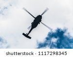 Flight of the helicopter,on sky background
