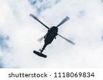 Flight of the helicopter,on sky background.