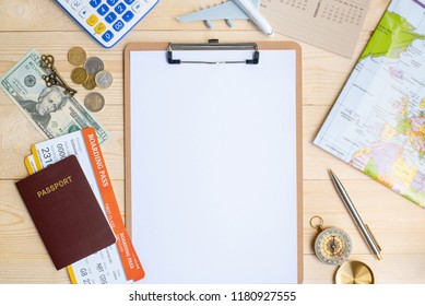 Flight Itinerary  Long Weekend, Travel Plan Schedule Concept : Top View  Flat Lay Of White Empty  Blank Paper On Clipboard, US Dollar Money, Coins, Passport, Boarding Pass, Plane, Map On Wood Table