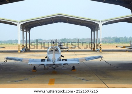 Flight, military and hangar with plane at airport for rescue mission, transportation and emergency. Wings, airforce service and flying with fighter jet on runway for cargo, pilot and journey