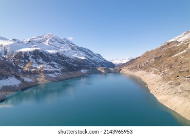 Flight Over Lac Du Chevril, Surrounded By Snow-capped Mountains, On The Road To Tignes And Val D'Isère, In Isère, France