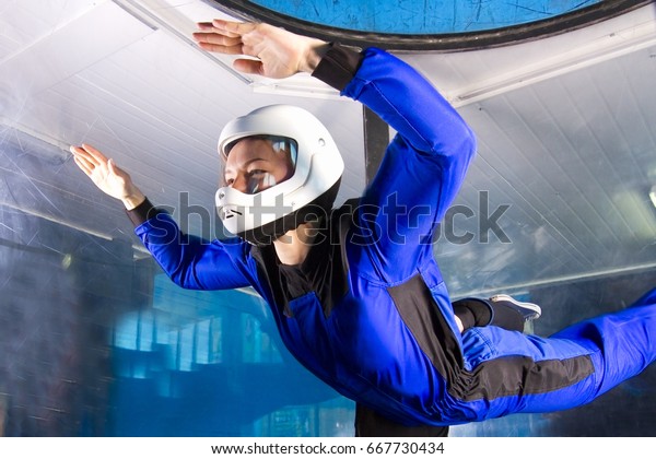 The flight\
of a pretty young girl in a wind\
tunnel