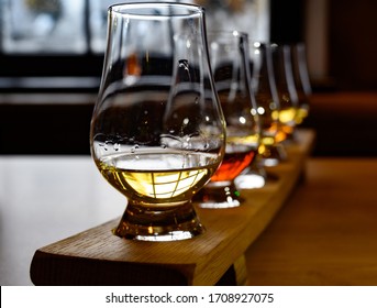 Flight Of Scottish Whisky, Tasting Glasses With Variety Of Single Malts Or Blended Whiskey Spirits On Distillery Tour In Scotland, UK