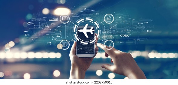 Flight ticket booking concept with person using a smartphone - Shutterstock ID 2202759013