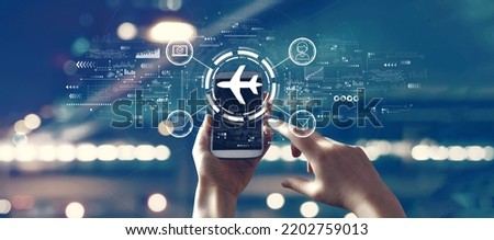 Flight ticket booking concept with person using a smartphone