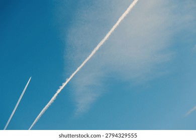 Flightpath creates a striking pattern against blue sky