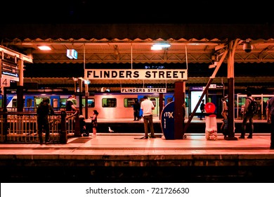 Flinders Street Station, Melbourne, Victoria, Australia - June 11, 2016 People Waiting For The Train On Platform At Night