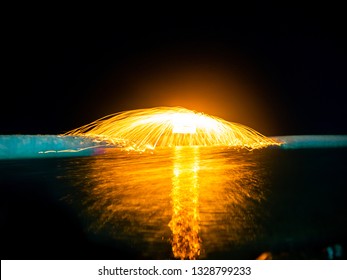Fling the fire by the pool . Soft focus