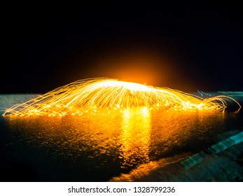 Fling the fire by the pool . Soft focus