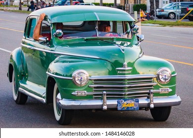 Flint Mi / USA – August 16 2019: Driver showing off their classic cars during the yearly Back to the Bricks cruise week along Saginaw Street through into downtown Flint Mi. - Shutterstock ID 1484146028