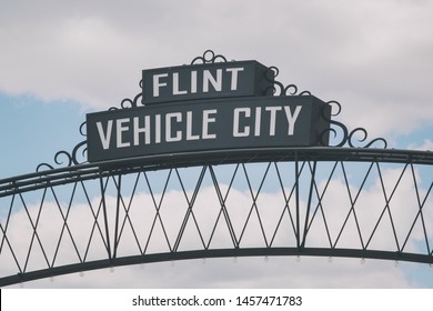 Flint, Michigan Downtown Gateway Sign Showing Vehicle City. Known Widely For Their Water Quality And Safety Issues.