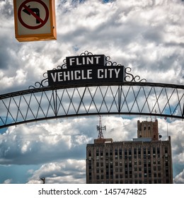 Flint, Michigan Downtown Gateway Sign Showing Vehicle City. Known Widely For Their Water Quality And Safety Issues.